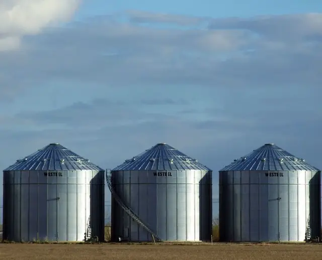 Three grain bins on the prairie