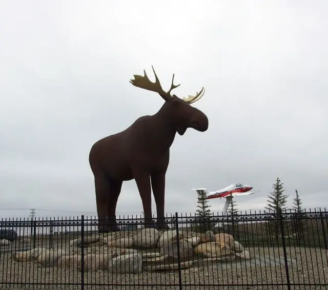 Mac the Moose statue with a Snowbird jet